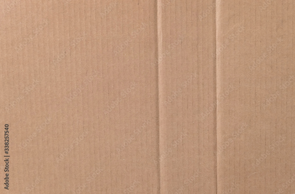 Fototapeta premium Brown cardboard sheet texture background. Texture of recycle paper box in old vintage pattern background.