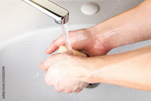 Wash hands with soap to prevent for coronavirus infection, hygiene to stop spreading coronavirus. Wet soapy hands