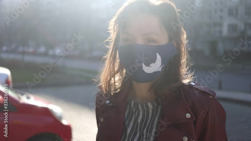 Stylish woman wearing defence from covid19 in park.