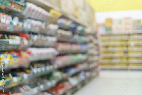 Wallpaper Mural Supermarket blurred background.snack on shelves at grocery. Torontodigital.ca