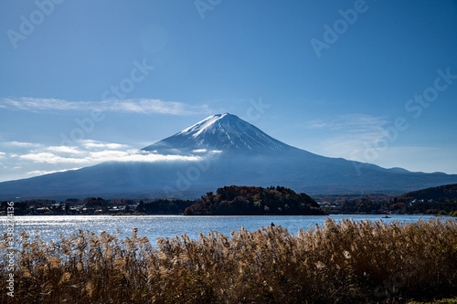 Mount Fuji at noon by Kawaguchiko lake, Japan