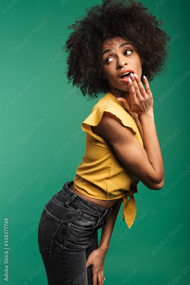 Photo of african american woman expressing surprise and looking aside Photo of african american woman expressing surprise and looking aside