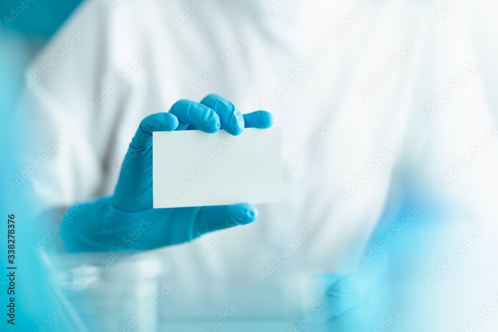blank paper holding by doctor wearing blue gloves blank paper holding by doctor wearing blue gloves