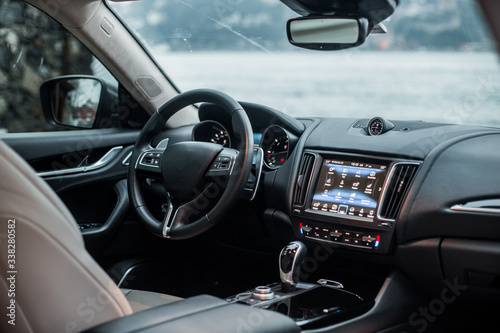 Navigation monitor, control wheel and front seat of a black car © azerbaijan-stockers