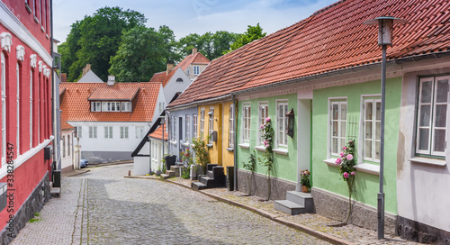 Fotografia, Obraz Panorama of a street with little colorful houses in Haderslev, Denmark