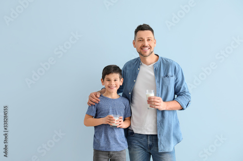 Father with son drinking mi...