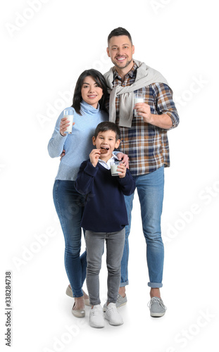 Family drinking milk on whi...