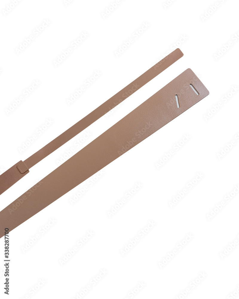 Brown leather female belt on a white background. Brown leather female belt on a white background.