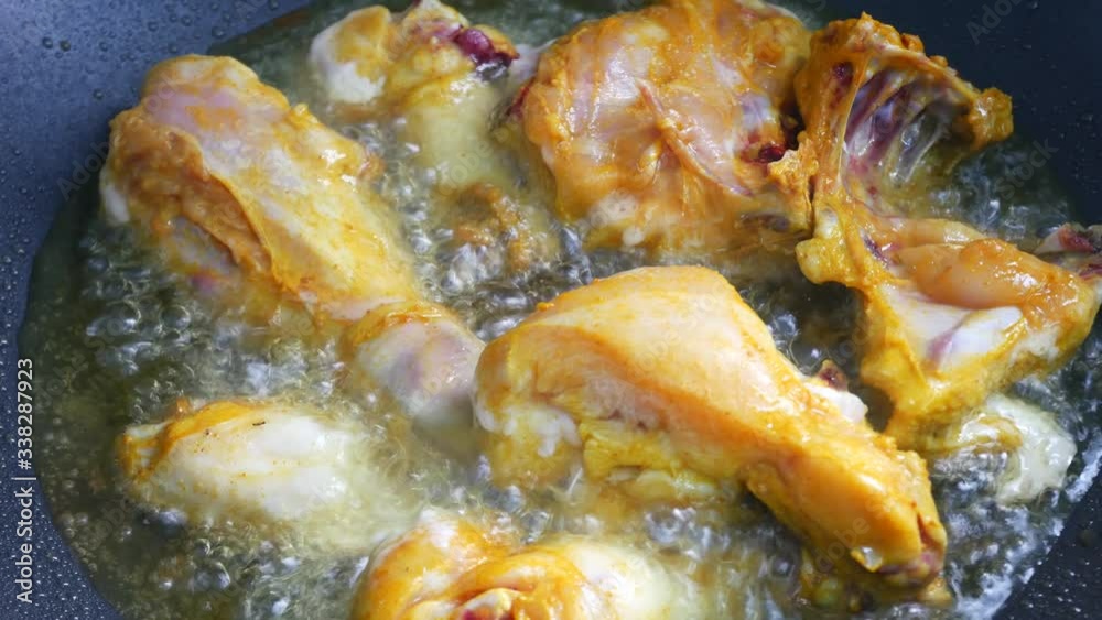 Chicken meat cut into small pieces and put into the hot pan. It is fried using hot cooking oil until cooked and crunchy. Chicken meat cut into small pieces and put into the hot pan. It is fried using hot cooking oil until cooked and crunchy.