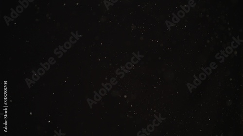 4k Natural Dust Organic Floating particles on black background. Dust in air atmosphere for your projects  Just drop it over your footage and use blending  screen  mode