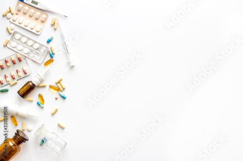 Fototapeta Naklejka Na Ścianę i Meble -  Pharmacy - pills, tablets - flu, cold health care. on white background from above copy space