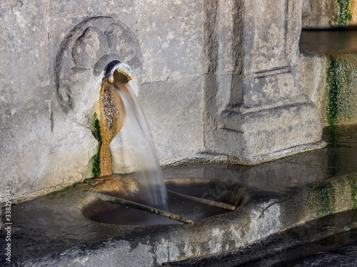 Detail view of a water jet at As Burgas hot springs in the city center. photo