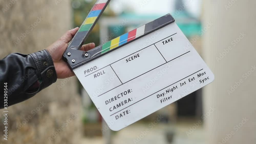 Blank Customizable Clapperboard Being Clapped With One Hand In Slow Motion