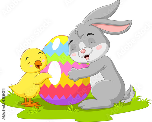 Cartoon little rabbit with chick and easter egg