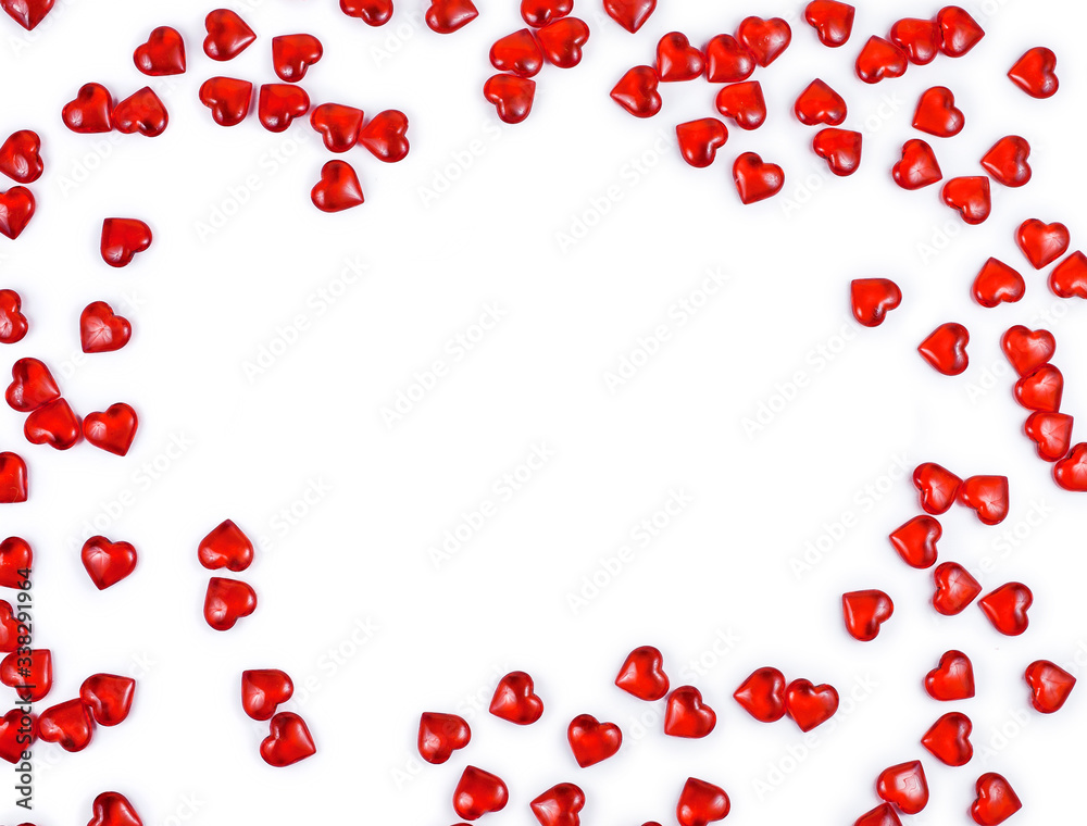 Frame made of red decorative hearts isolated on a white background. St. Valentine`s day concept. Text space.