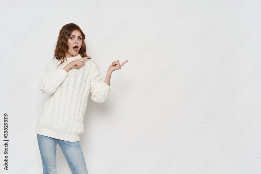 young woman pointing at something young woman pointing at something