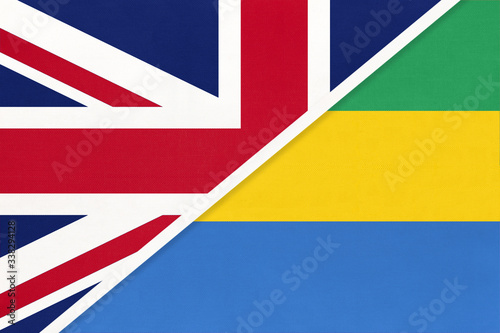 United Kingdom vs Gabon national flag from textile. Relationship between two European and African countries.