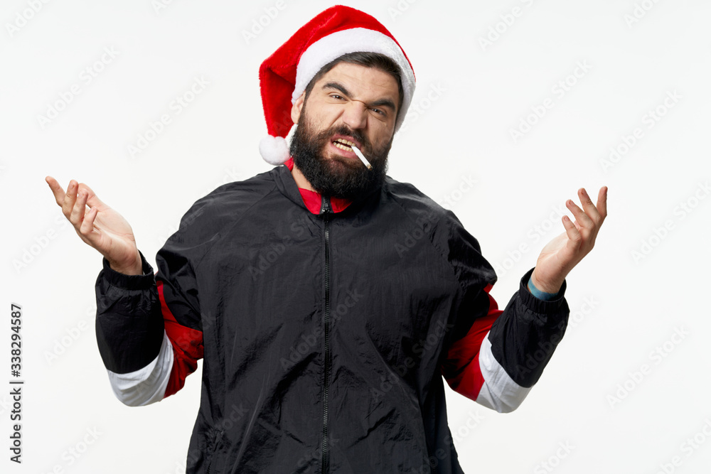Naklejka premium young man in santa hat