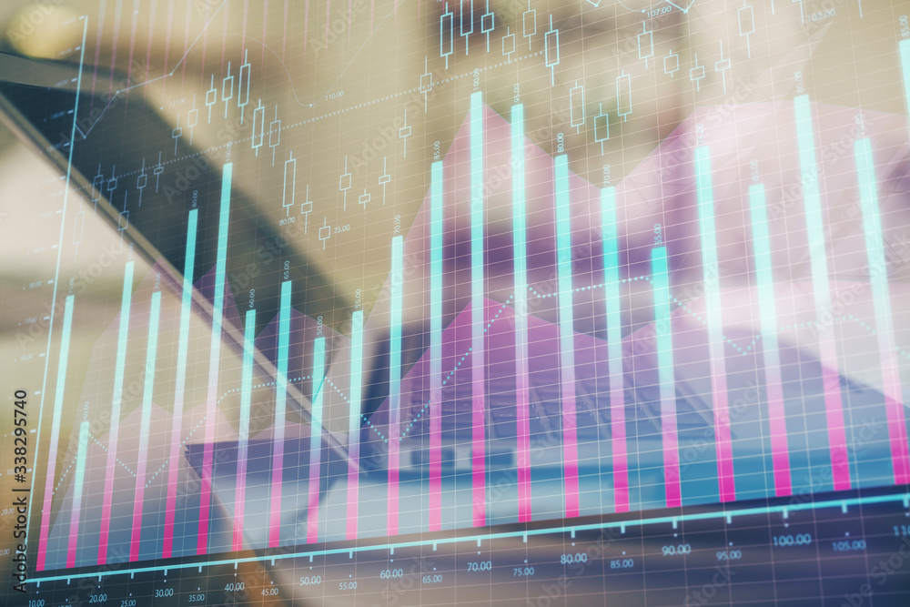 Forex graph hologram on table with computer background. Double exposure. Concept of financial markets. Forex graph hologram on table with computer background. Double exposure. Concept of financial markets.