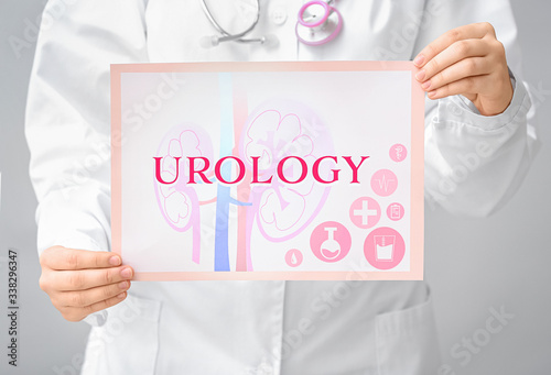 Doctor holding paper with w...