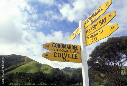Rustic directional sign near Waikawau in New Zealand photo
