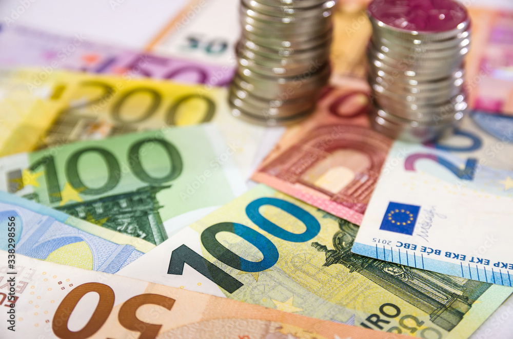 stacks of coins and euro banknotes .Business concept. Much money. stacks of coins and euro banknotes .Business concept. Much money.