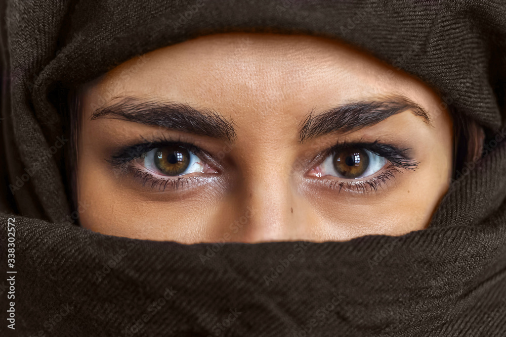 close up female portrait, brown eyes woman portrait with brown scarf covered her face close up female portrait, brown eyes woman portrait with brown scarf covered her face