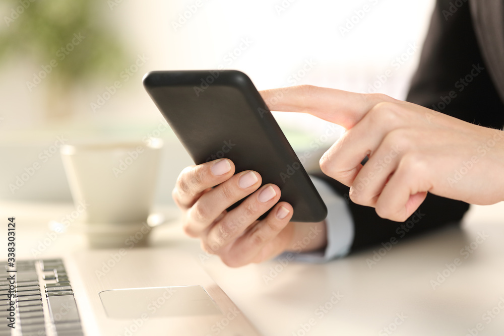 Executive woman hands checking phone at office