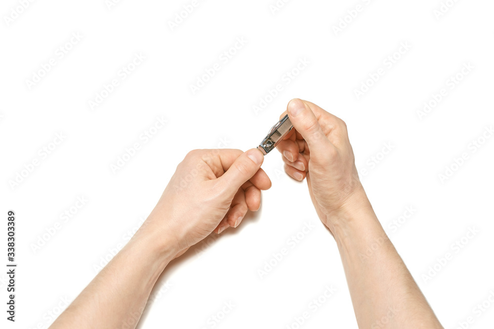 Man do manicure at home. Self hand routine. Copy space for text. Male finger procedure. White background isolated. Copyspace. Thumb fingernail clean. Man manicurist service Man do manicure at home. Self hand routine. Copy space for text. Male finger procedure. White background isolated. Copyspace. Thumb fingernail clean. Man manicurist service