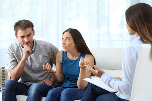 Husband flirting with therapist in couple therapy photo