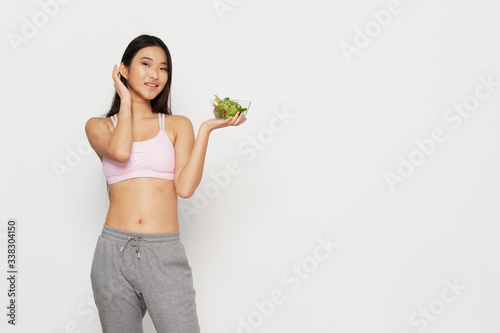 young woman holding a healthy salad © SHOTPRIME STUDIO