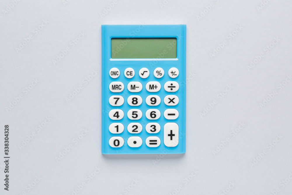 Modern calculator on grey background Modern calculator on grey background
