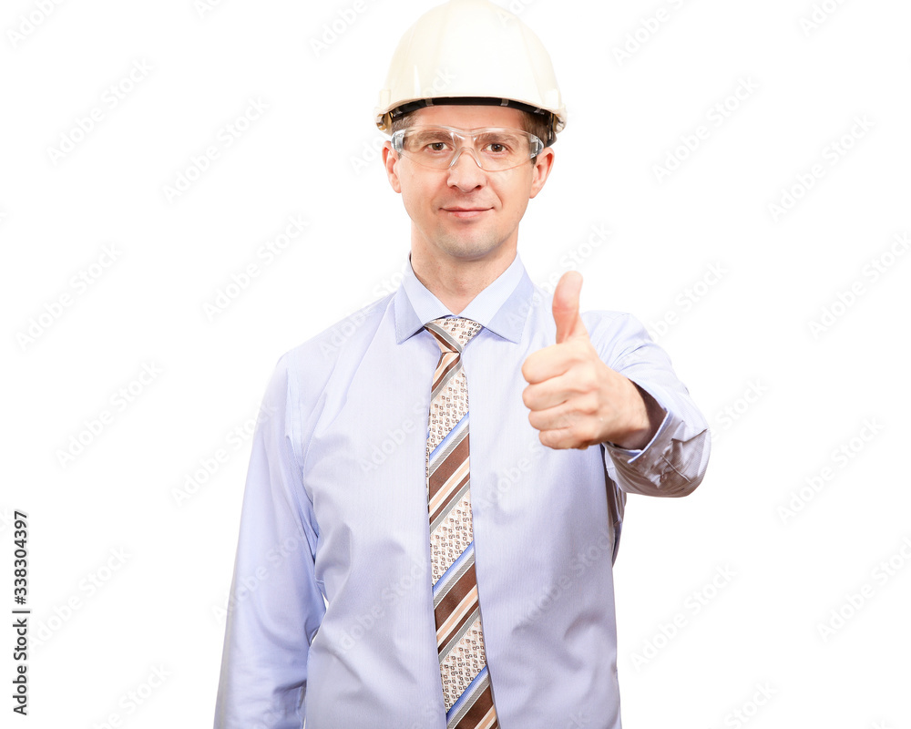 Confident male engineer in white construction helmet, shirt, tie, smiles, shows gesture OK, thumb up, looks into camera. Isolated Confident male engineer in white construction helmet, shirt, tie, smiles, shows gesture OK, thumb up, looks into camera. Isolated