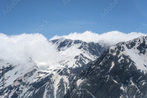 clouds cover Barron saddle at mt. Sealy range, New Zealand