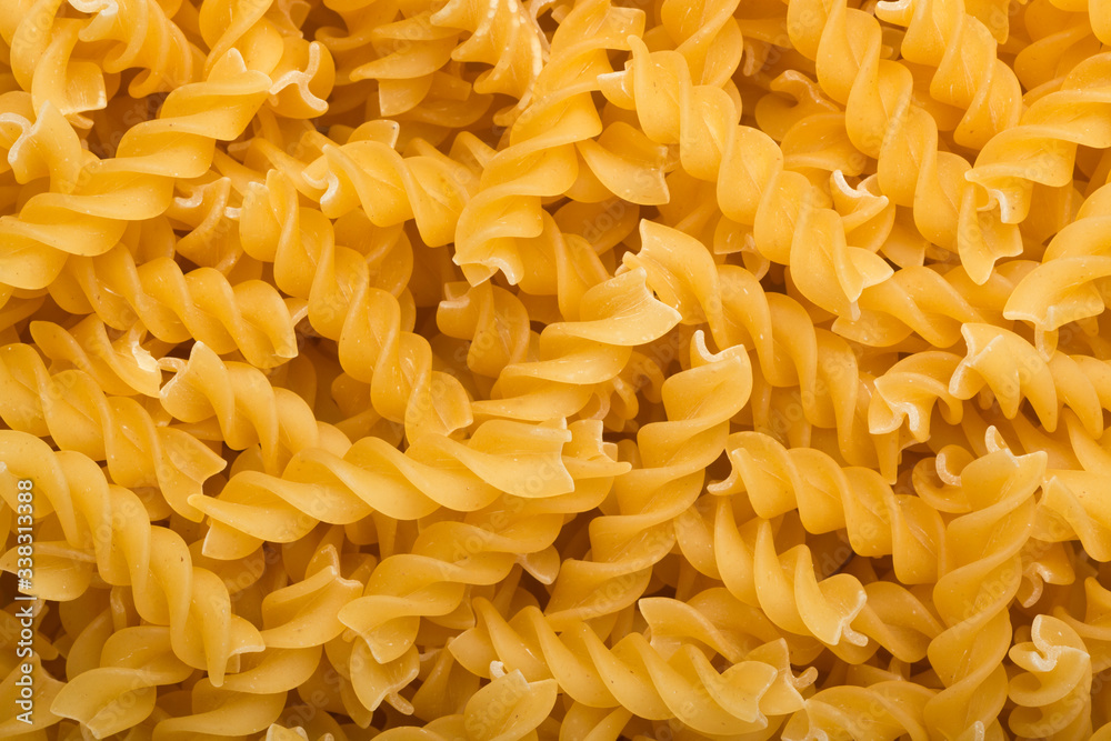 Lots of uncooked fusilli pasta
Lots of uncooked fusilli pasta