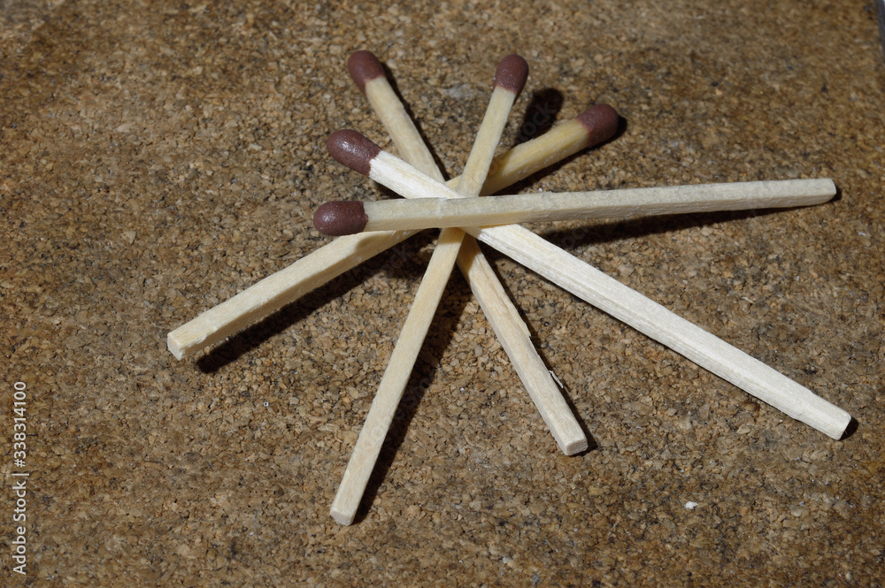 Match collection - five matches on a grainy background Match collection - five matches on a grainy background