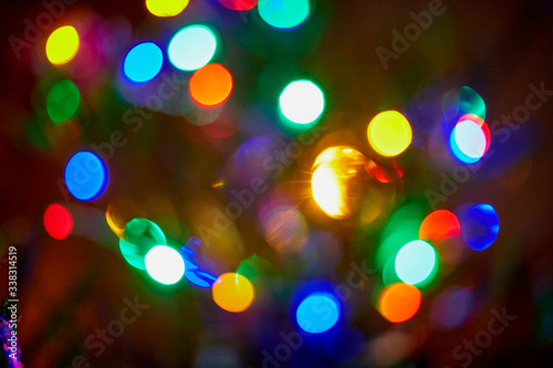 Abstract texture with light colored bokeh and black background © keleny