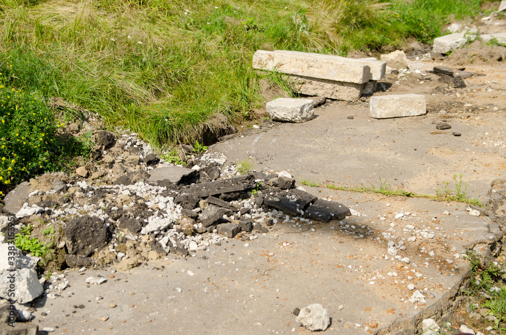 an old broken curb lies on the sidewalk for replacement. sidewalk repair an old broken curb lies on the sidewalk for replacement. sidewalk repair