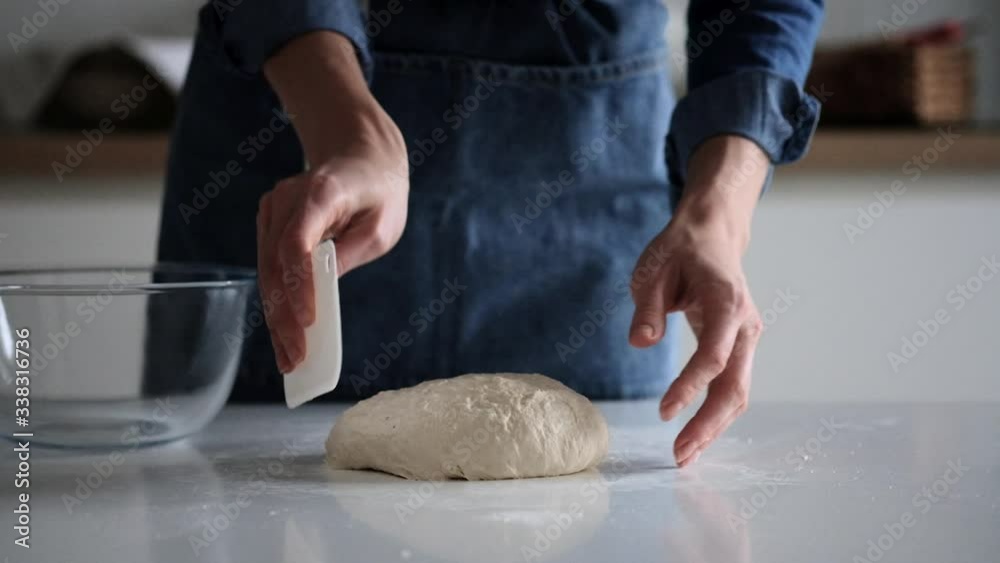 Woman puts dough in a glass bowl. Bread. 4K Woman puts dough in a glass bowl. Bread. 4K