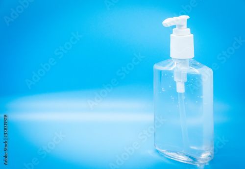Clear hand sanitizer jel isolated on a blue background. © checubus