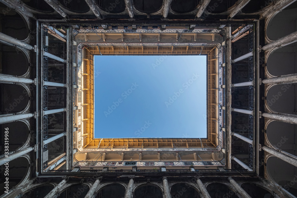 Viewing upwards from the central open space of old building in Budapest