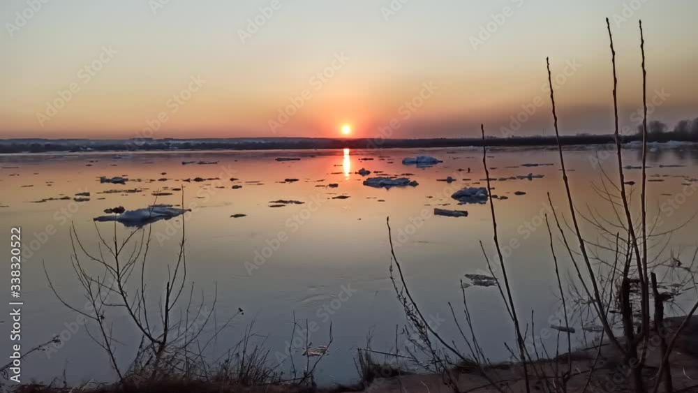 sunset over the river, ice floes float, spring. timelaps sunset over the river, ice floes float, spring. timelaps