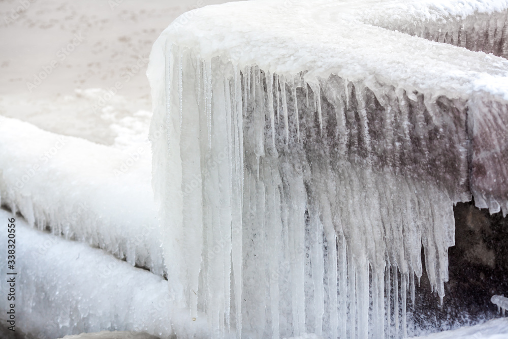 Frozen granite, icing. Frost, an element of an icy building Frozen granite, icing. Frost, an element of an icy building