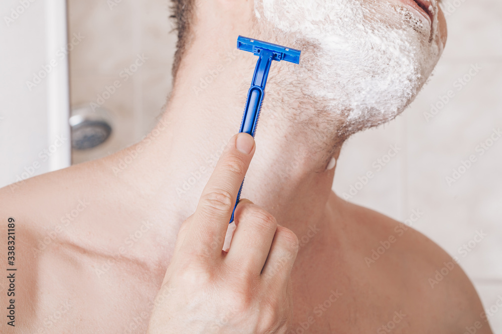 close up of a man shaving close up of a man shaving