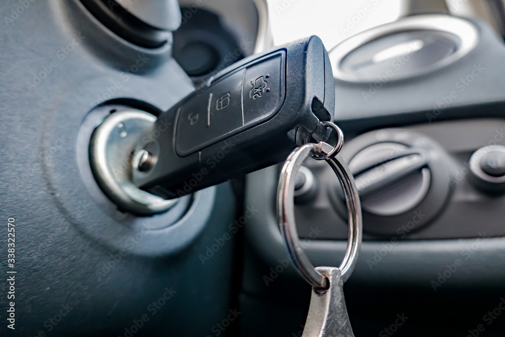 Close up and selective focus of car key in the ignition switch