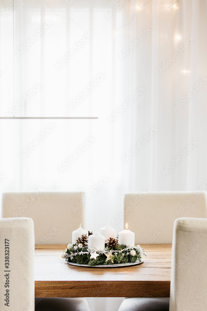 Advent Wreath with four candles as table centerpie. The first candle