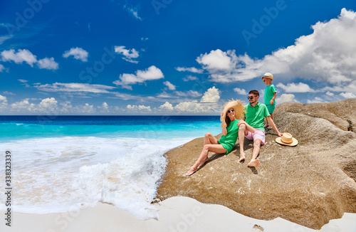 Family with three year old boy on beach. Seychelles, Mahe. photo