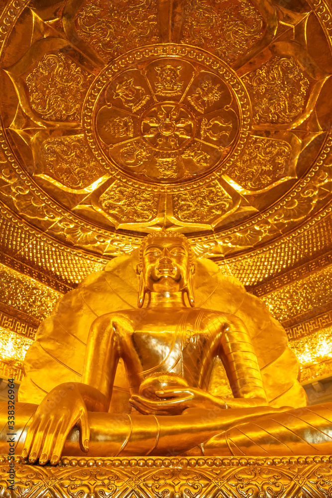 Fototapeta premium Gia Vien District, Vietnam - CIRCA Apr 2020: Golden Buddha statue in Bai Dinh Temple.
