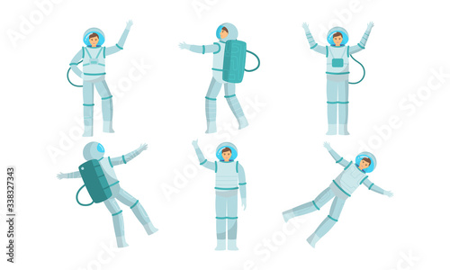 Set of young austronauts in special metallic costume in outer space