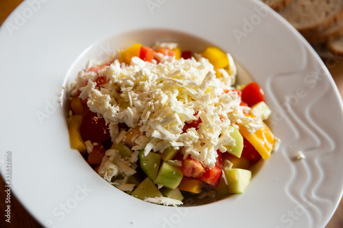 Shopska salad with vegetables and feta cheese photo